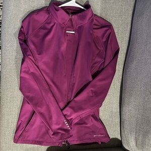 Athletic sweater by Ogio. 91% Polyester 9% Spandex